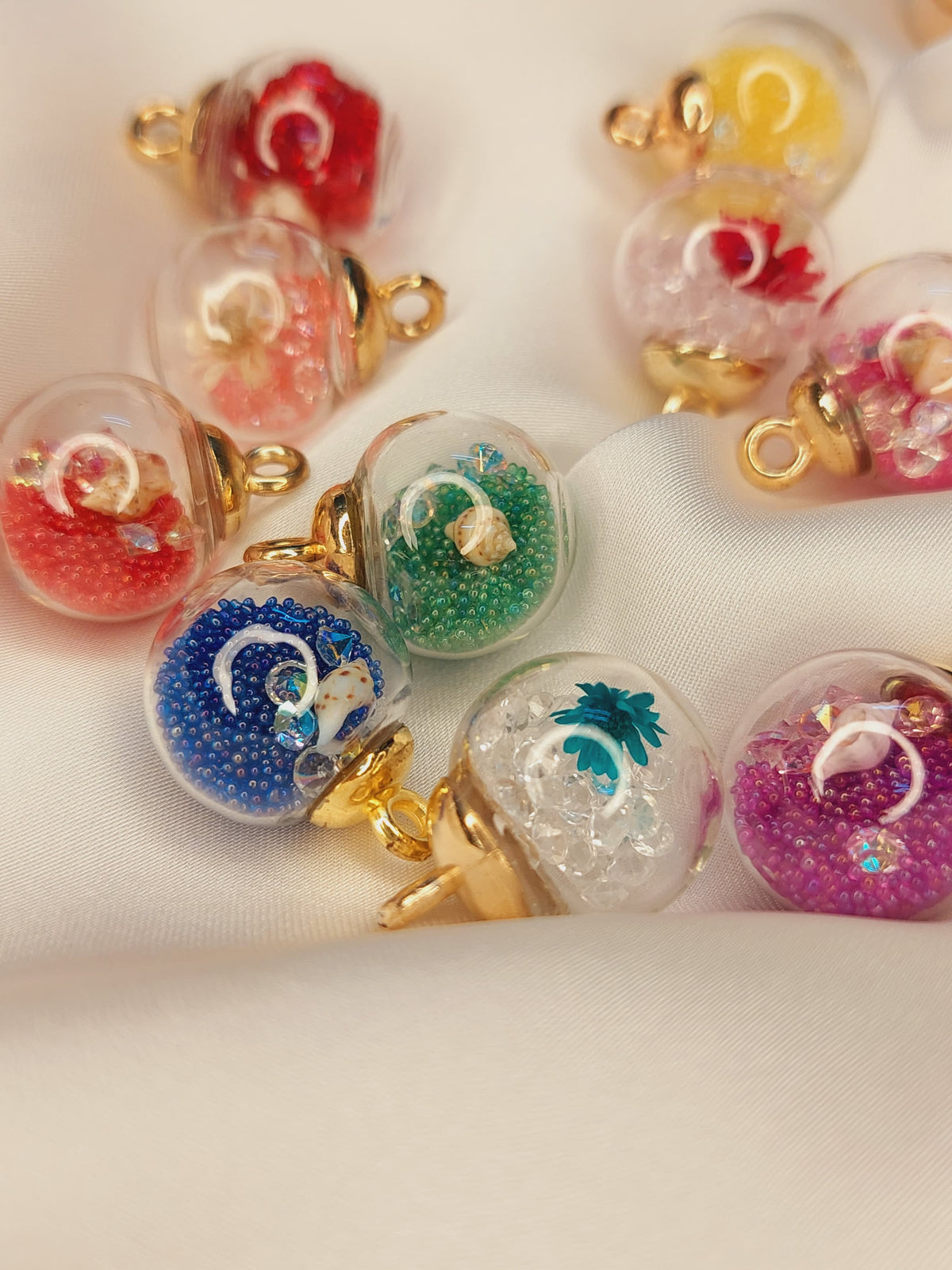 Imported Glass Globe Charms with dry flowers and sea shells